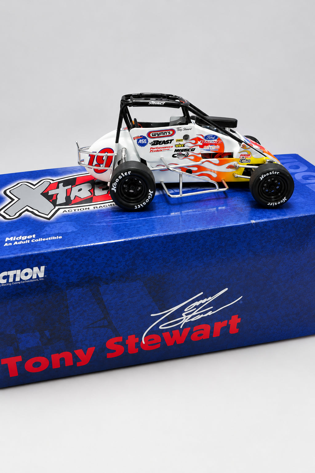 Side view of Tony Stewart No. 19 Turkey Night midget diecast with its original box